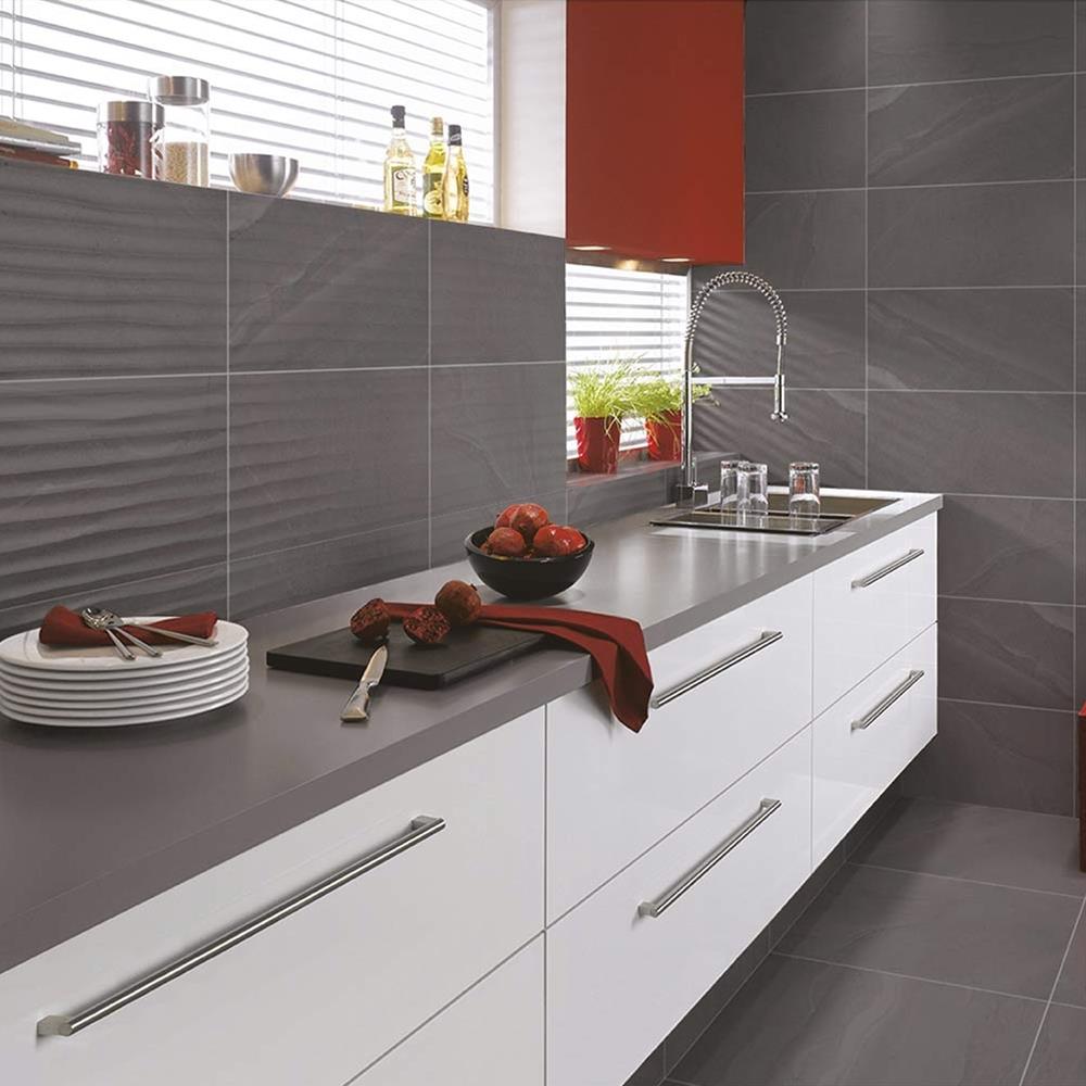 British Stone Anthracite Wave decoarative tile in a modern kitchen with matching floor and wall tiles