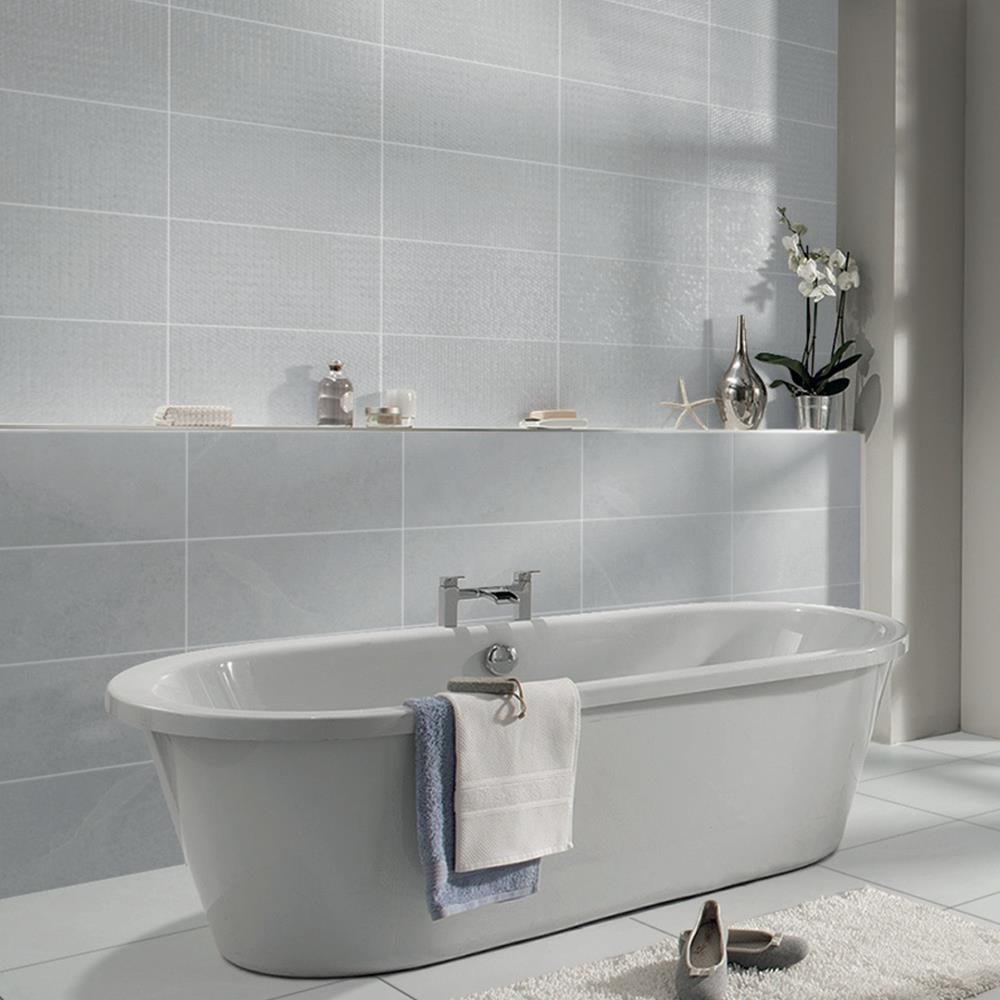 Cliveden grey ceramic wall Eco Tile being used as a feature behind a freestanding bath
