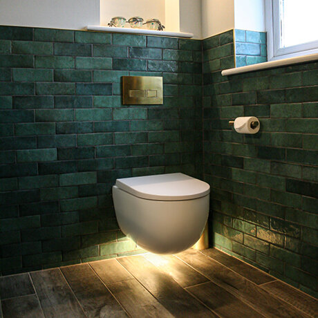 Green tiles in bathroom setting