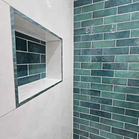 Green tiles in bathroom setting