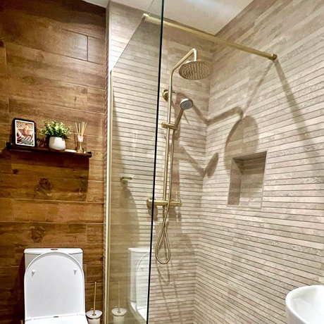 White wall tiles in bathroom in natural setting